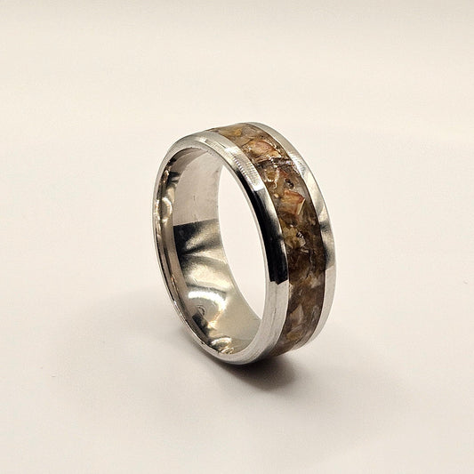 Silver ring on a light gray background