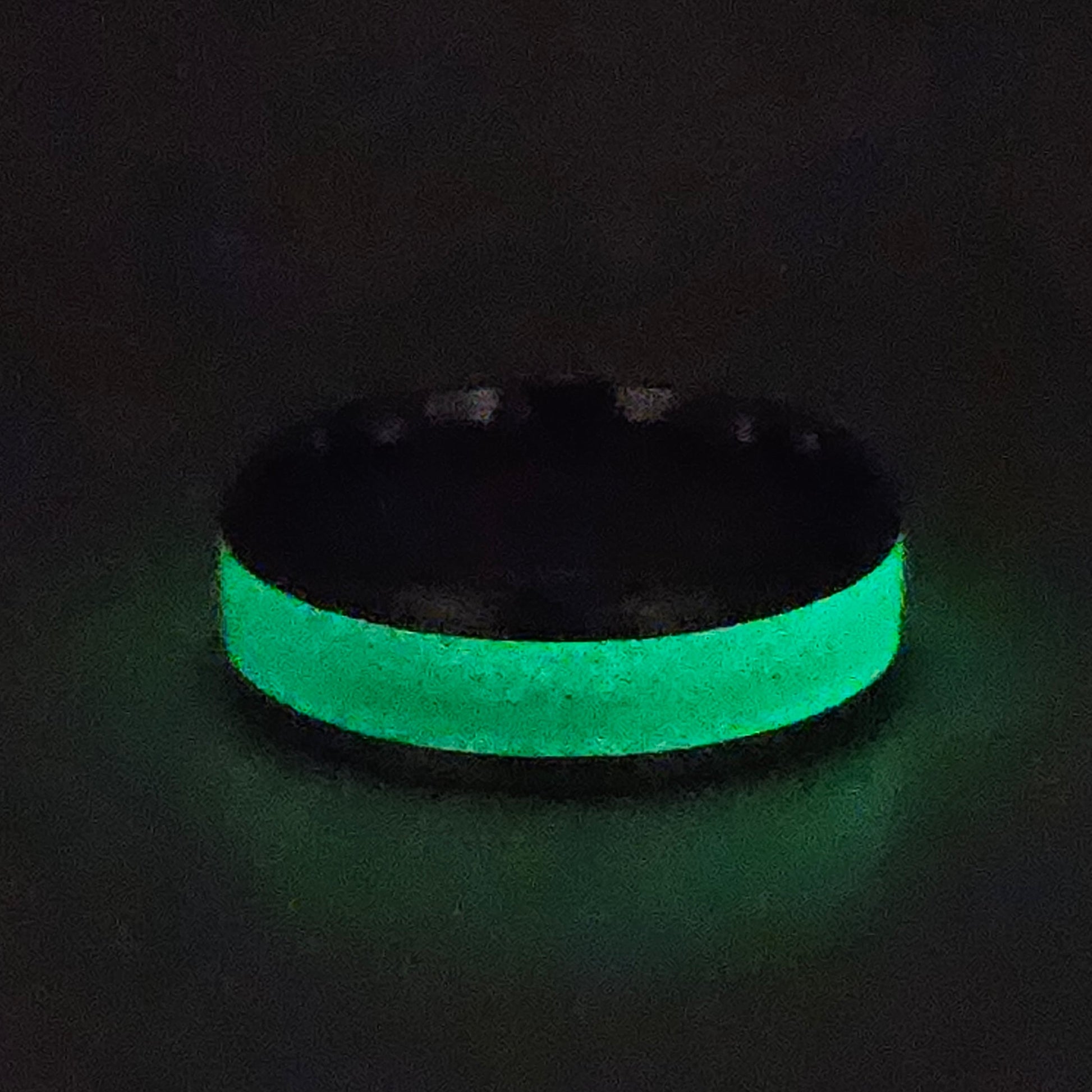 Glowing green ring on a black background