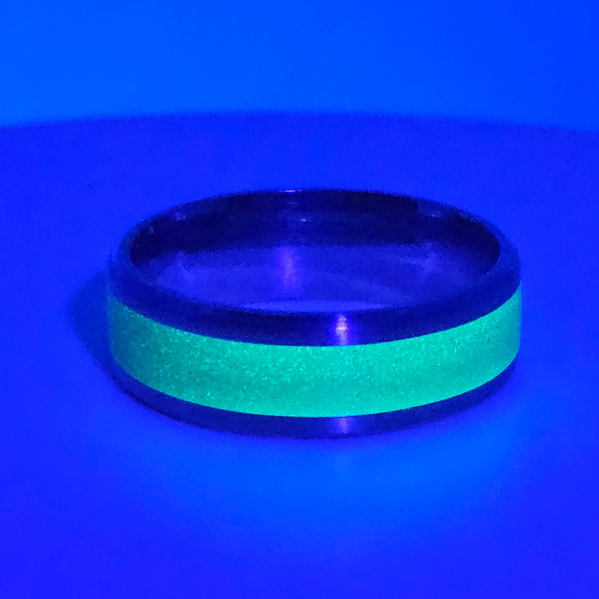 Green glow-in-the-dark ring on a blue background