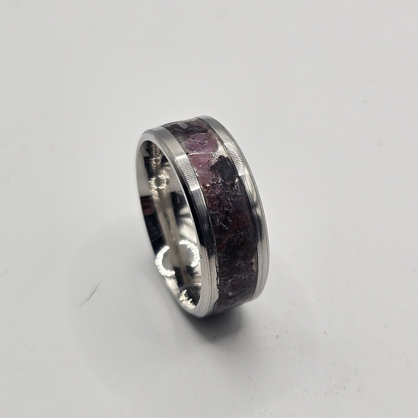 Silver ring on a light gray background